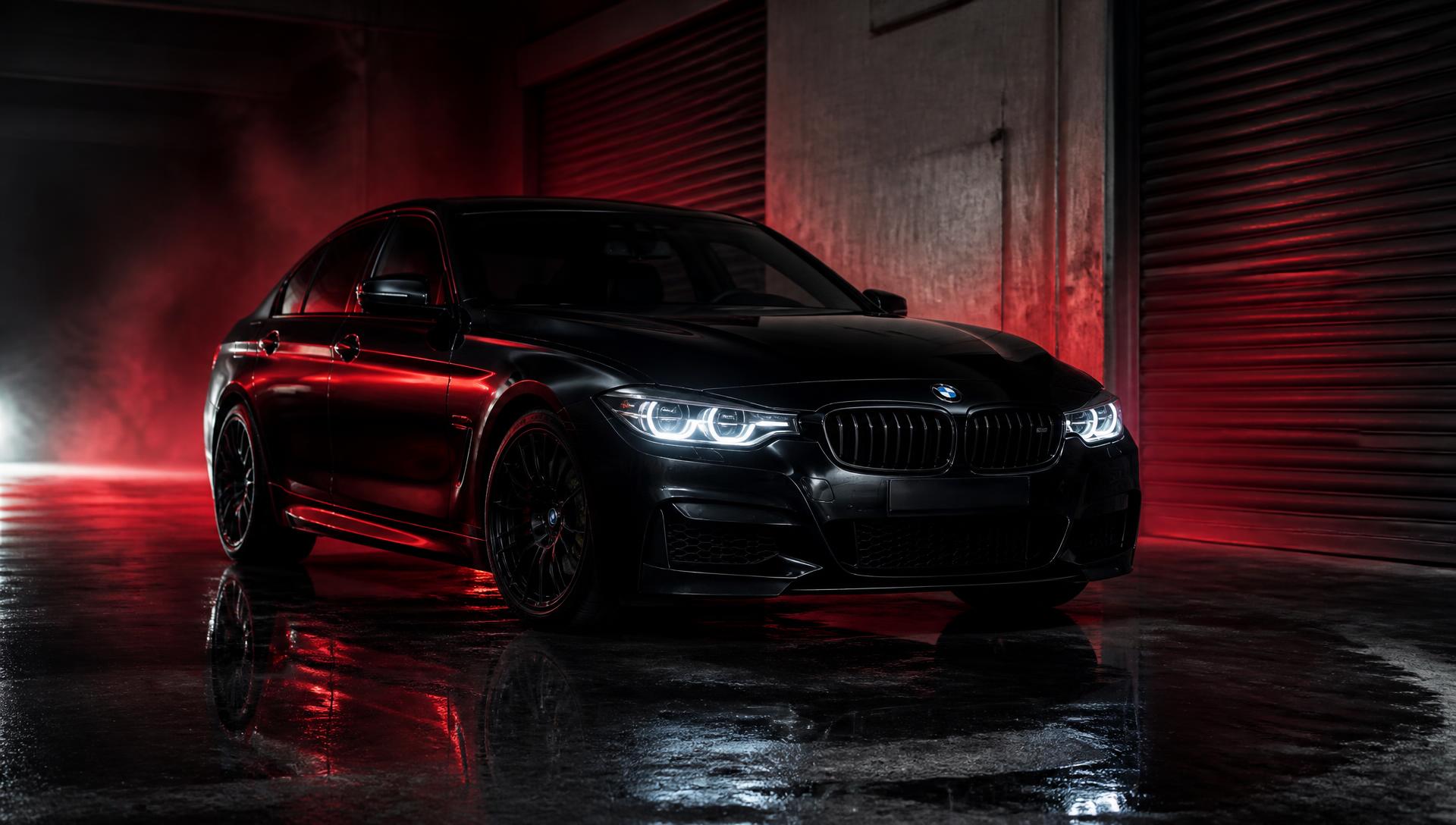 Berline BMW noire premium dans l'atelier T.SK AUTO